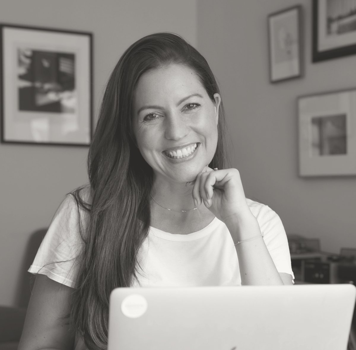 Melanie Schneider smiling at her desk